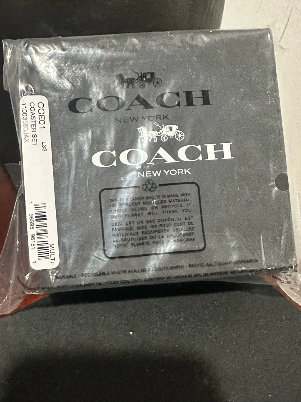 COACH Round Leather Coaster Set in Black, Orange, Red, Green